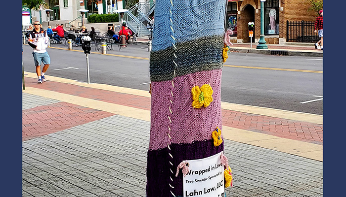 downtown street with yarn decorated tree
